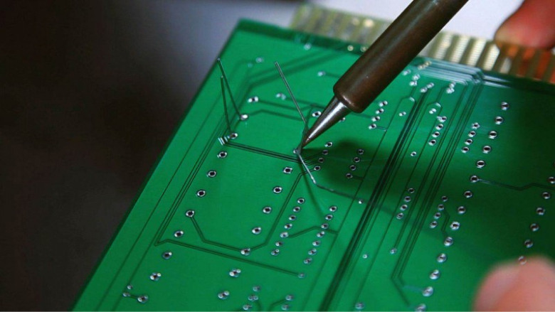Soldering radio components onto the board